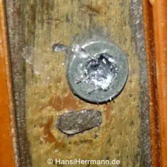 Demolierter Schraubenkopf